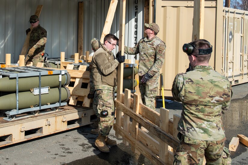 A photo of Airmen offloading munitions.