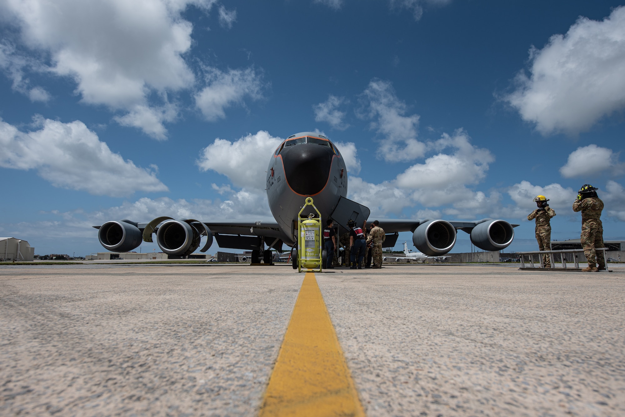 Firefighters prepare an airplane for training.