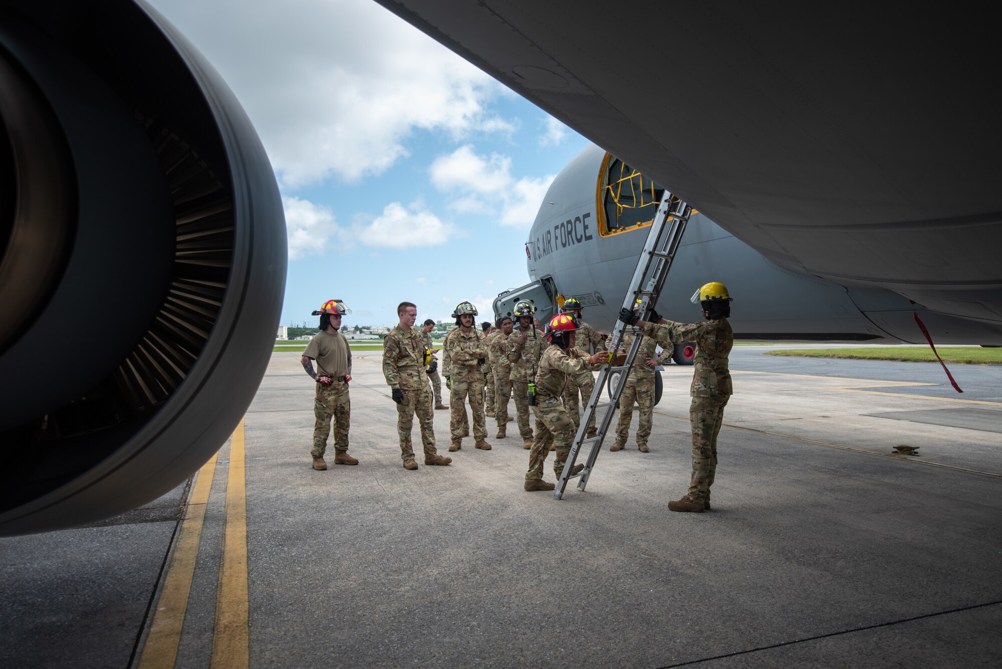Airmen use ladder to climb on airplane.