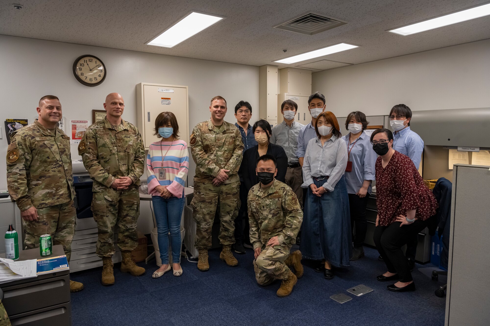Group of people pose for a group photo.