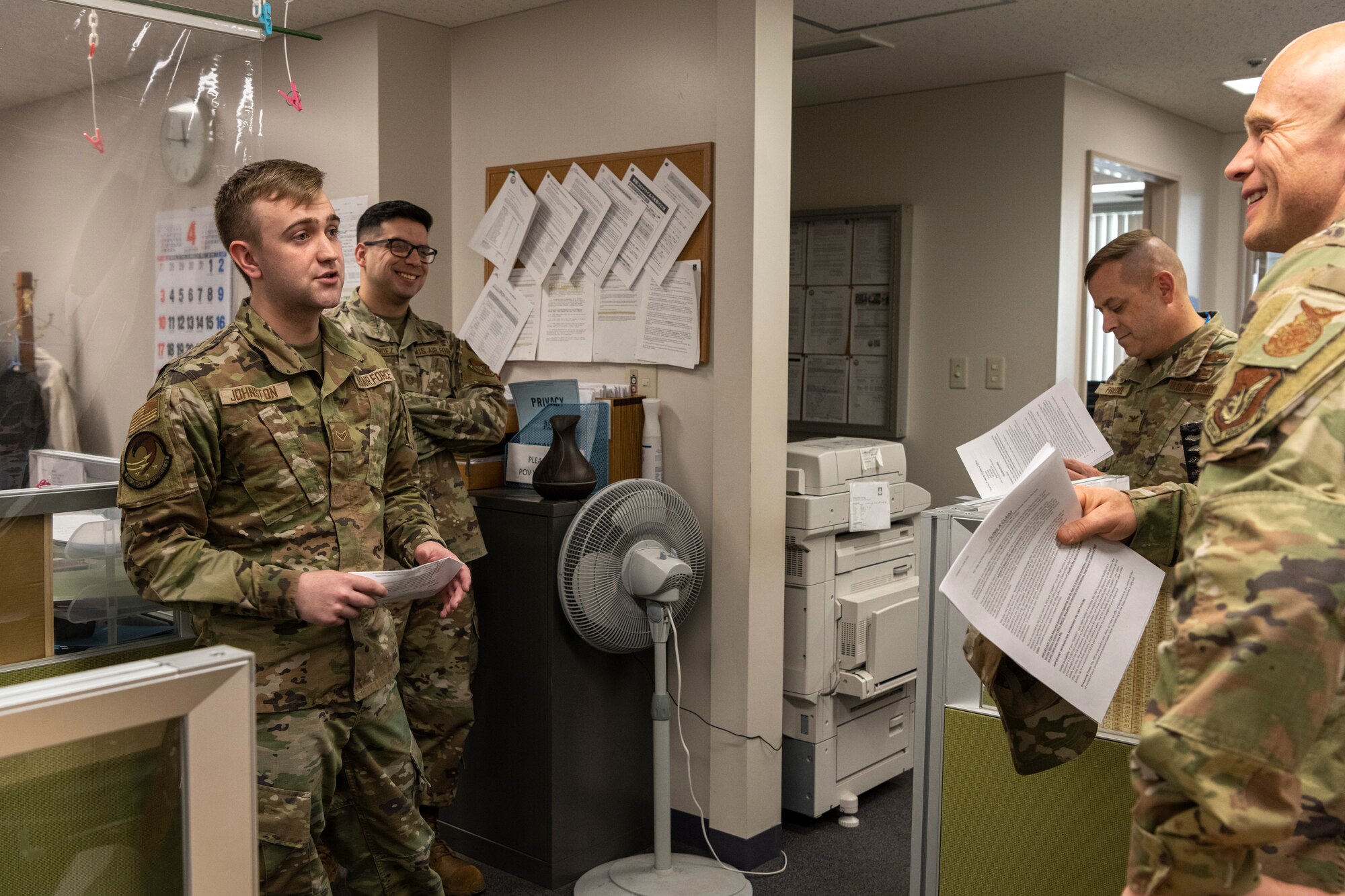 Airman briefing the commander and command chiefs on day-to-day duties.