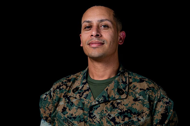 U.S. Marine Corps Gunnery Sgt. Bruce Jones, an inspections chief with Marine Corps Installations Pacific, poses for a portrait on Camp Foster, Okinawa, Japan, April 11, 2022. Jones shares his story on the establishment of his trekking group, the challenges and tragedies he faced, and the perseverance and dedication it took for him to continue his adventurous lifestyle with his group and son. (U.S. Marine Corps photo by Cpl. Alex Fairchild)