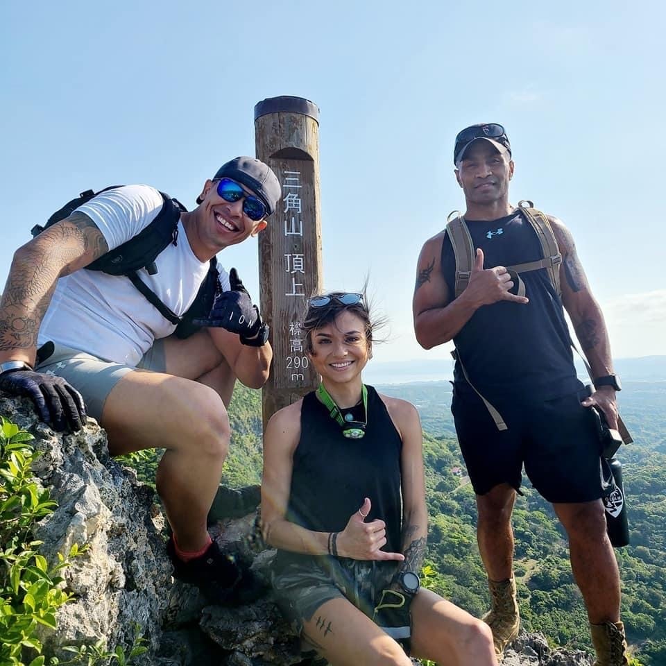 U.S. Marine Corps Gunnery Sgt. Bruce Jones, an inspections chief with Marine Corps Installations Pacific, poses with his trekking group on Okinawa, Japan. Jones shares his story on the establishment of his trekking group, the challenges and tragedies he faced, and the perseverance and dedication it took for him to continue his adventurous lifestyle with his group and son. (Courtesy photo by Gunnery Sgt. Bruce Jones)