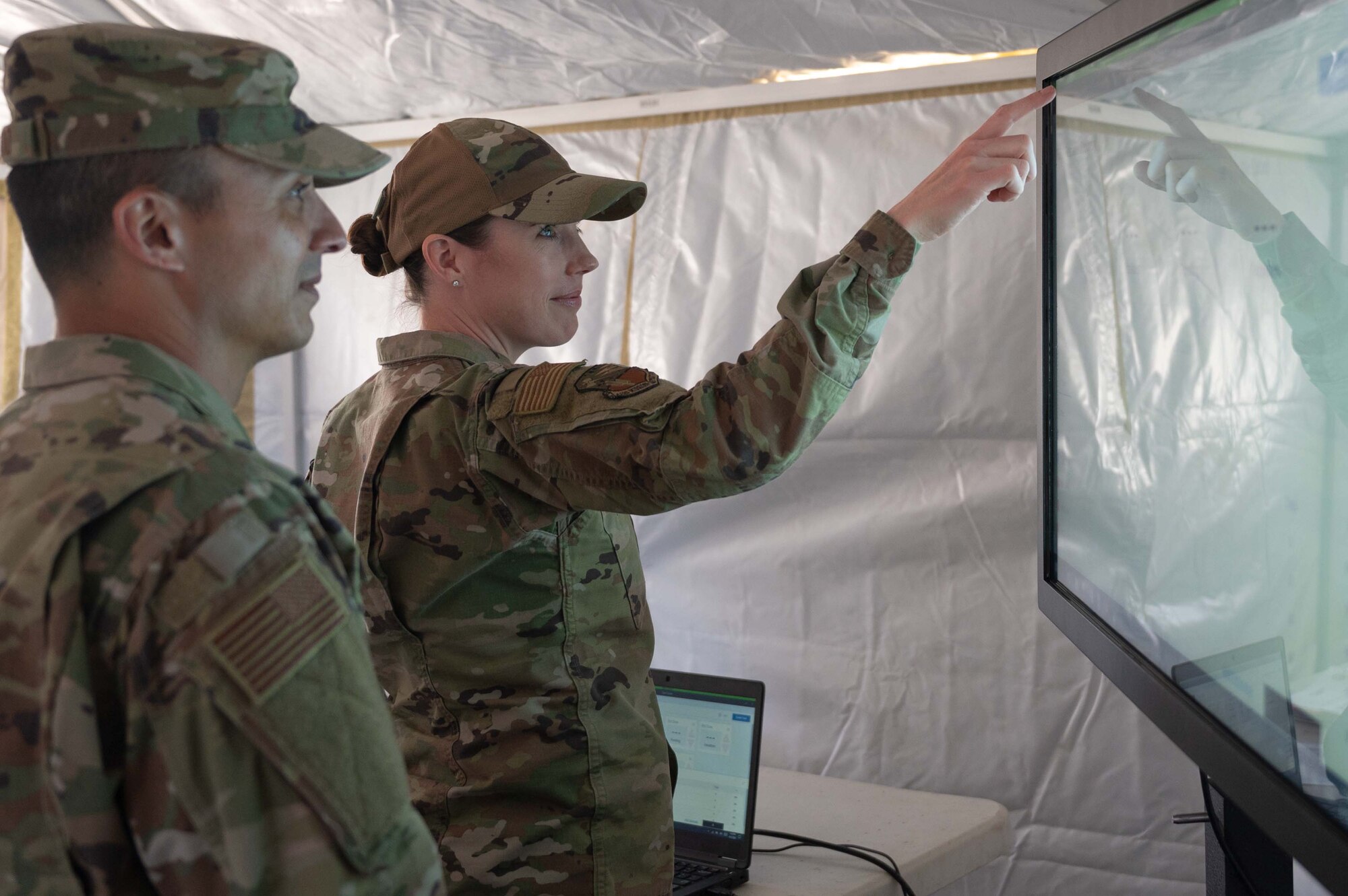 Tech. Sgt. Rhoda Smith (right) and Msgt Antonio Jurado, 162nd FSS Specialists, review data on the National Guard’s interoperability network platform that is used by the CERFP components for command and control communications.