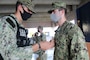 Sailors assigned to U.S. Naval Base Guam’s (NBG) Navy Security Forces (NSF) were frocked to the next pay grade during a ceremony at the NBG Security Compound Dec. 23.