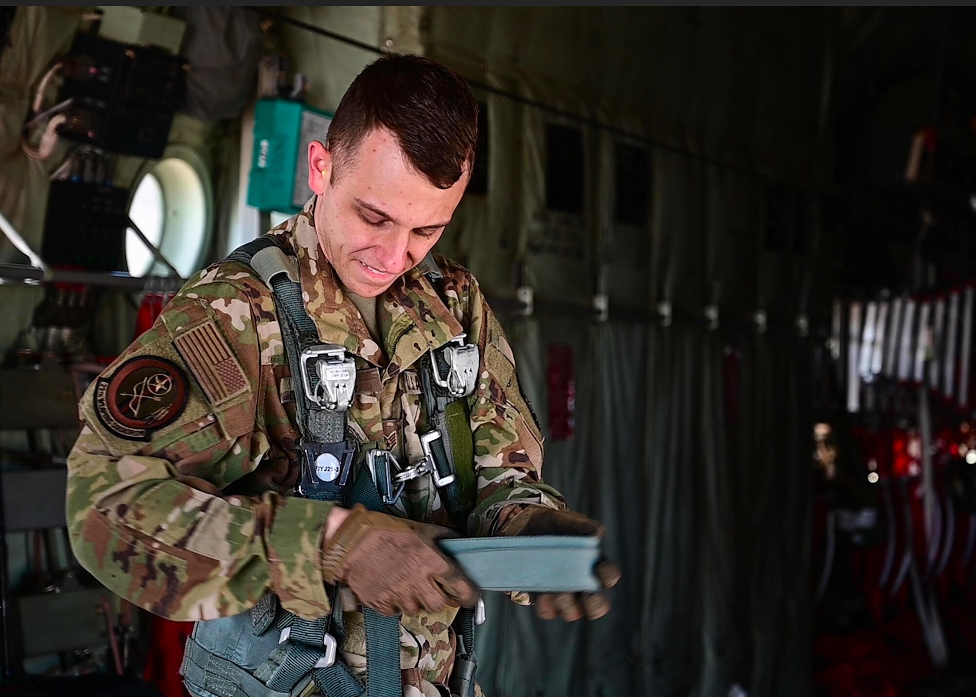 A loadmaster from the 29th Weapons Squadron prepares for a flight