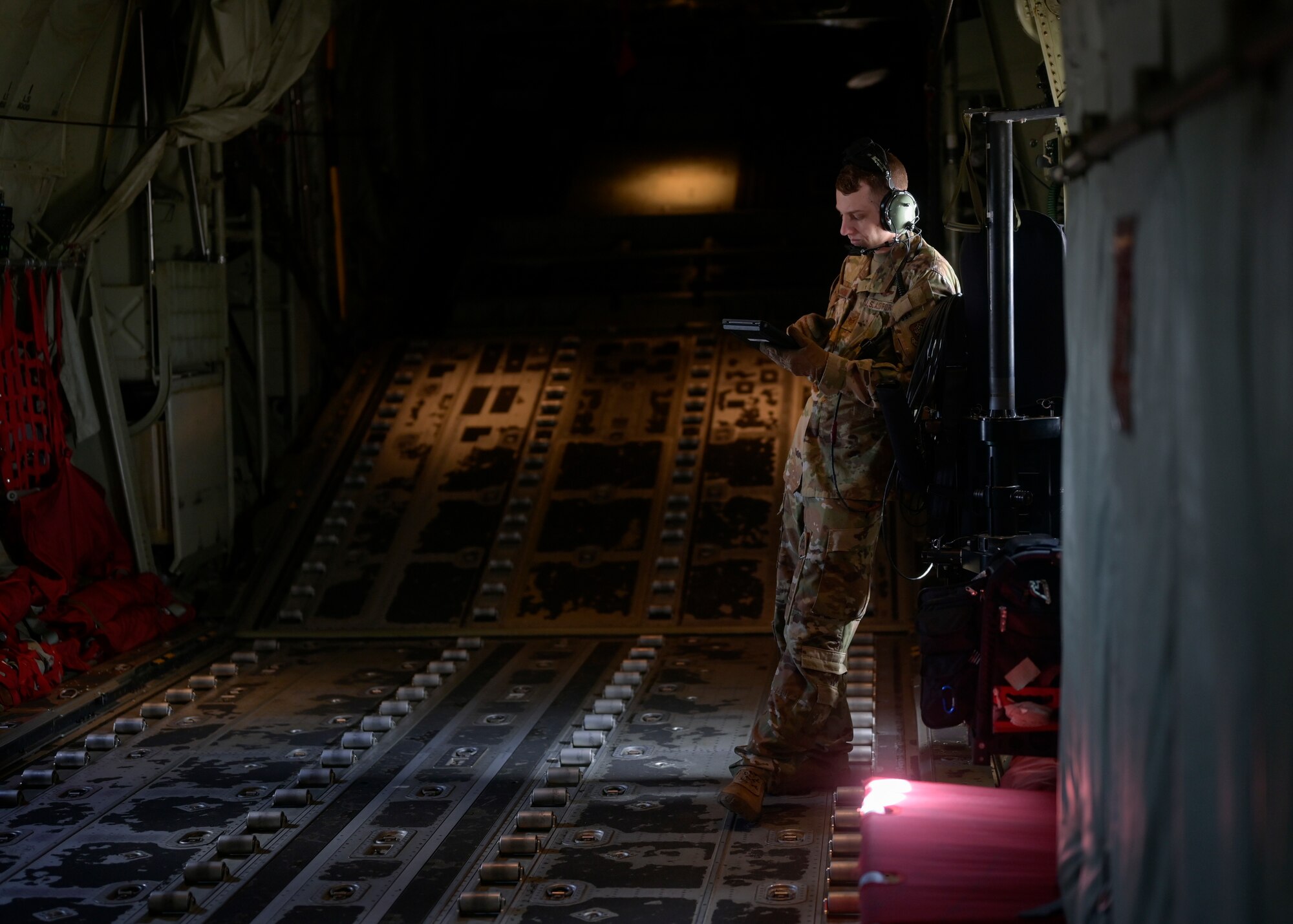 A loadmaster from the 29th Weapons Squadron prepares for a flight