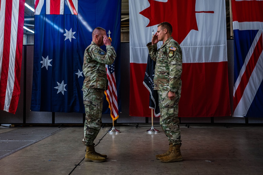 U.S. Space Force Lt. Col. Matthew Lintker, 18th Space Defense Squadron commander, right, salutes U.S. Space Force Col. Marc Brock, Space Delta 2 commander, to assume command of the 18 SDS during a re-designation ceremony at Vandenberg Space Force Base, Calif., April 13, 2022. The 18th Space Control Squadron was re-designated as the 18 SDS, and will continue to be U.S. Space Command’s premier provider of continuous, comprehensive and combat-relevant space domain awareness. (U.S. Space Force photo by Tech. Sgt. Luke Kitterman)