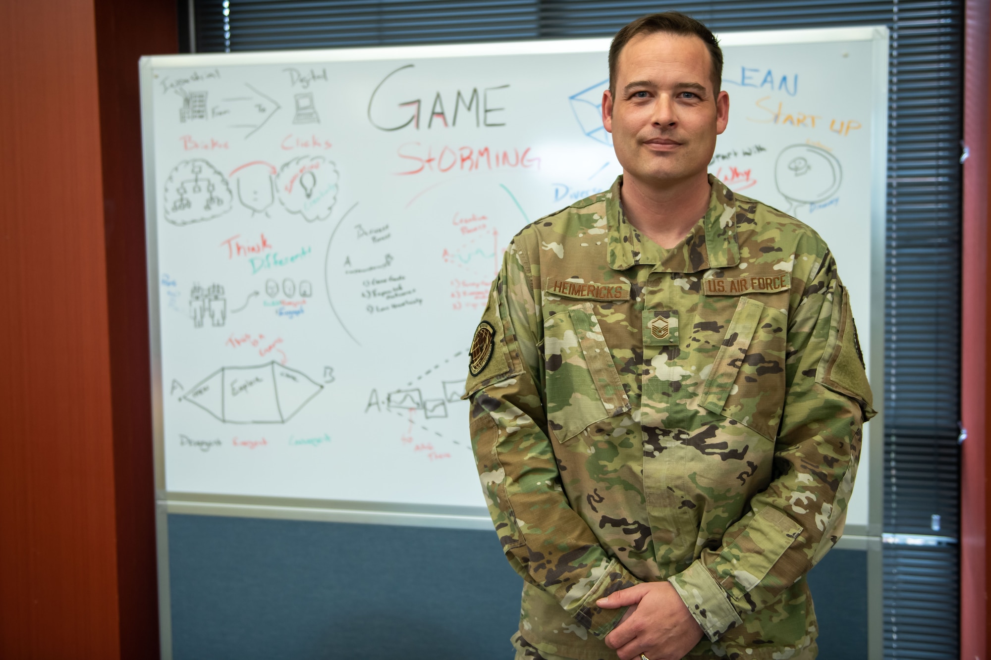 Master Sgt. Keith Heimericks, the 28th Bomb Wing career assistance advisor, poses for a photo in the RaiderWerx innovation room at Ellsworth Air Force Base, S.D., March 29, 2022.