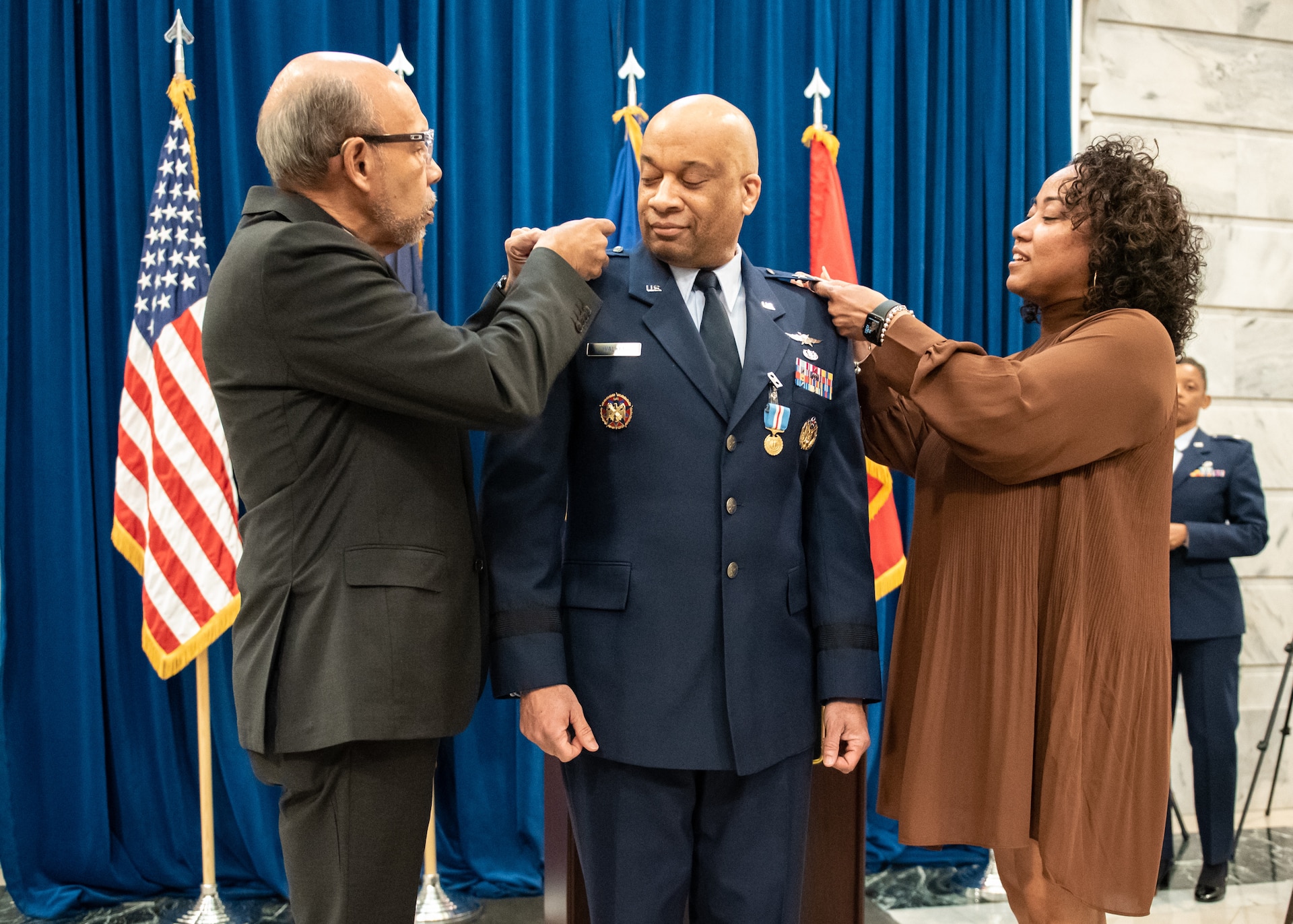 Charles M. Walker is promoted to the rank of major general during ceremony held in the Capitol Rotunda in Frankfort, Ky., March 12, 2022. Walker, who previously served as chief of staff for the Kentucky Air National Guard, is the director of the Office of Complex Investigations at the National Guard Bureau. Participating in the ceremony were Walker’s wife, Suleena Walker (right), and J. Michael Brown, left, secretary of the executive cabinet for the Commonwealth of Kentucky. (U.S. Air National Guard photo by Dale Greer)