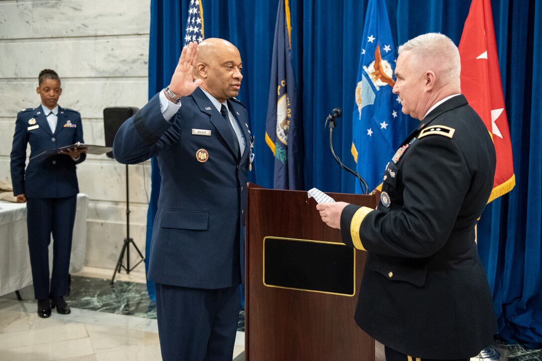 Army Maj. Gen. Haldane B. Lamberton (right), adjutant general of the Commonwealth of Kentucky, administers the oath of office to Maj. Gen. Charles M. Walker, director of the Office of Complex Investigations at the National Guard Bureau, during Walker’s promotion ceremony in the Capitol Rotunda in Frankfort, Ky., March 12, 2022. Walker previously served as chief of staff for the Kentucky Air National Guard. (U.S. Air National Guard photo by Dale Greer)