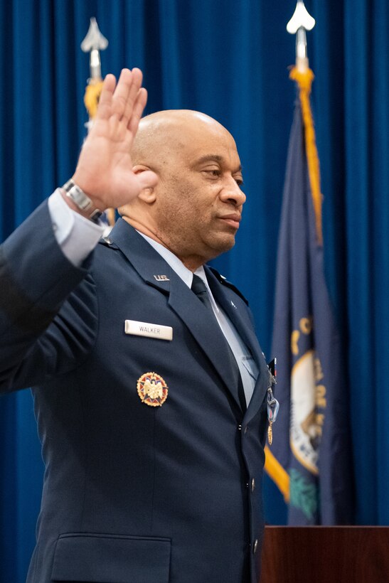 Maj. Gen. Charles M. Walker, director of the Office of Complex Investigations at the National Guard Bureau, takes the oath of office during his promotion ceremony, held in the Capitol Rotunda in Frankfort, Ky., March 12, 2022. Walker previously served as chief of staff for the Kentucky Air National Guard. (U.S. Air National Guard photo by Dale Greer)