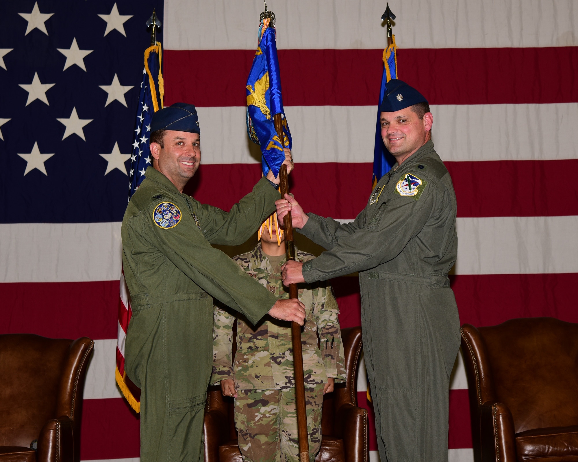 Col. Goldstein hands Lt. Col. McKee the 43rd FTS guidon.
