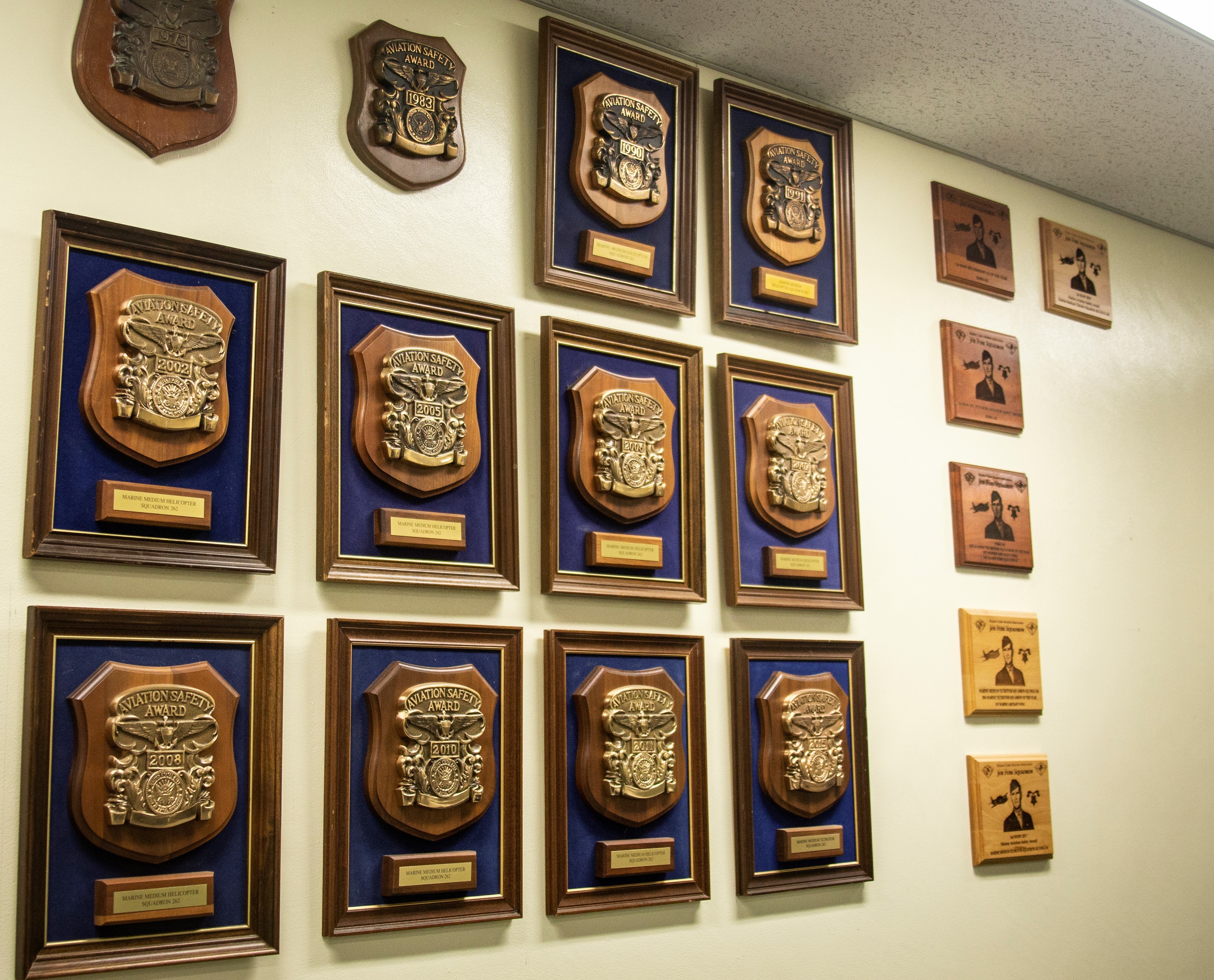 A wall full of awards and plaques