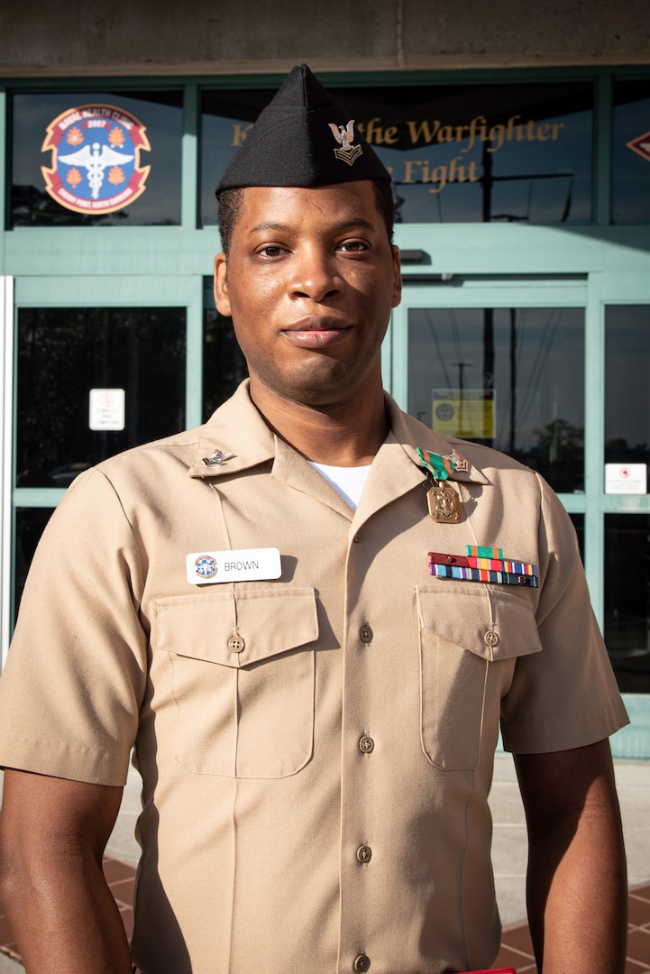 Hospital Corpsman Second Class Charles Brown Jr. saved the life of a Marine Corps Officer Candidate in late June, 2021 by proving immediate aid to him when he succumbed to hyperthermia during an introductory physical fitness test.  He received the Navy and Marine Corps Achievement Medal during a ceremony Friday, April 15.