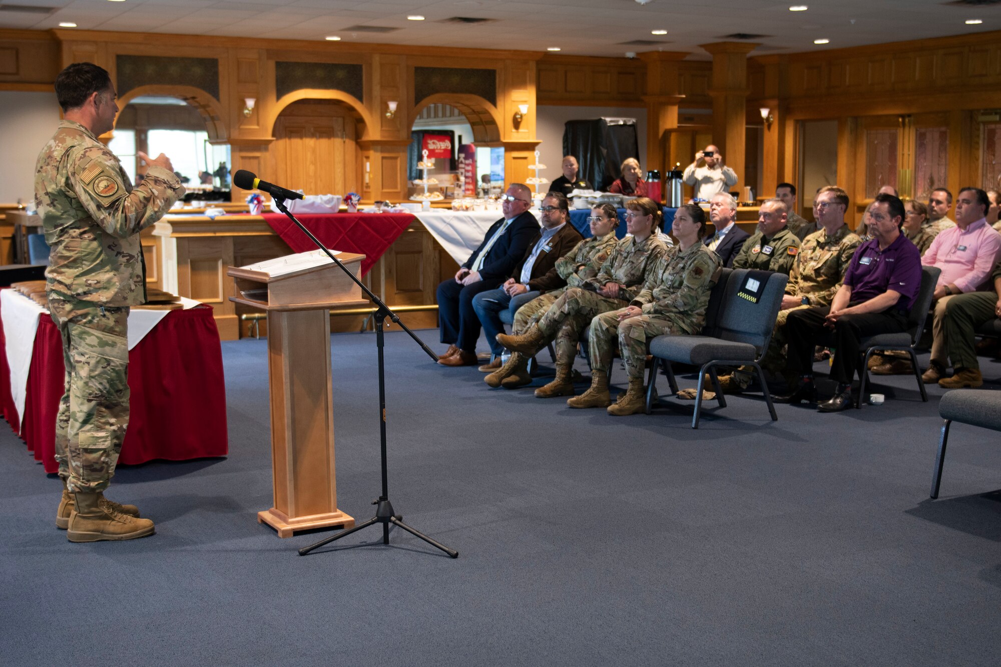 U.S. Air Force Col. Greg Moseley, 325th Fighter Wing commander, delivers a mission brief to the newest class of honorary commanders at Tyndall Air Force Base, Florida, April 13, 2022