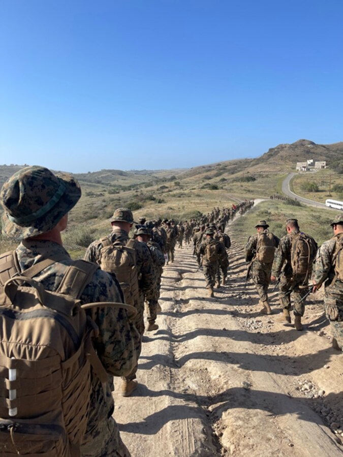 Marines of Marine Wing Support Squadron 473 and Marine Air Control Squadron 24 hike to Camp Talega for Warriors Night. Marines with MWSS-473 and MACS-24 conducted Expeditionary Advanced Base Operations (EABO) aboard Camp Pendleton Apr 6 – 10. EABO is a critical enabler to the Commandant’s Stand in Forces concept which provides small, mobile and lethal forces ready to deploy on short notice to disrupt an adversary’s plans at every point. Small, mobile, and lethal, Marine Corps stand-in forces will be ready to deploy on short notice to disrupt an adversary’s plans at every point.