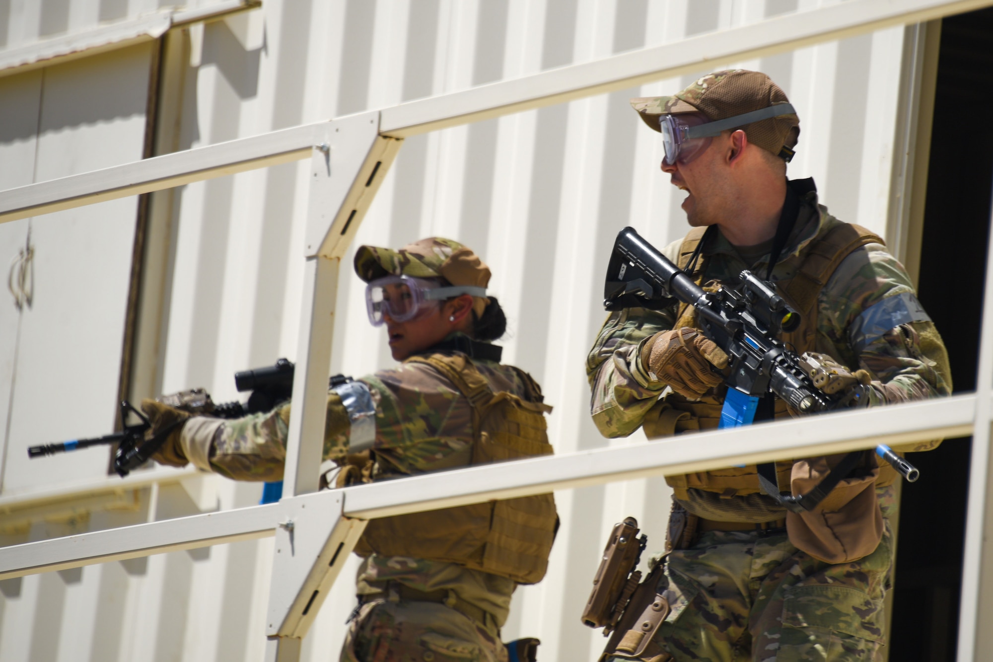 A photo of Airmen performing building clearing procedures.