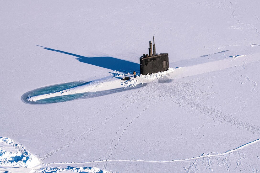 A submarine breaks through ice.