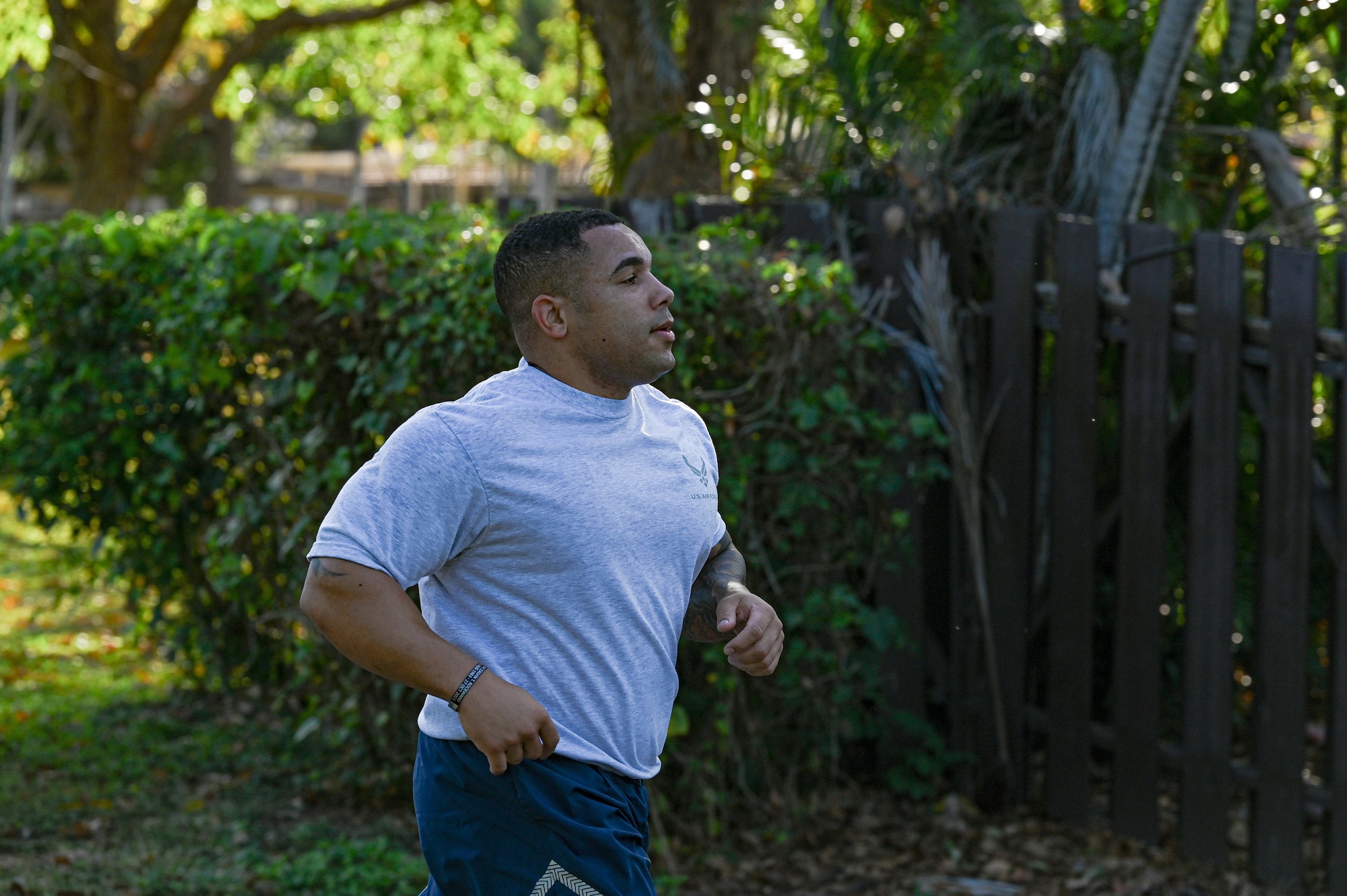 Tech Sgt. Jeffry Jordan, Noncomissioned Officer Academy student, runs during a school run at Joint Base Pearl Harbor-Hickam, Hawaii, April 14, 2022. The NCOA program focuses on the four areas of culture, leadership, problem solving, and mission to enable NCOs to lead their units and overcome challenges. (U.S. Air Force photo by 1st Lt. Benjamin Aronson)