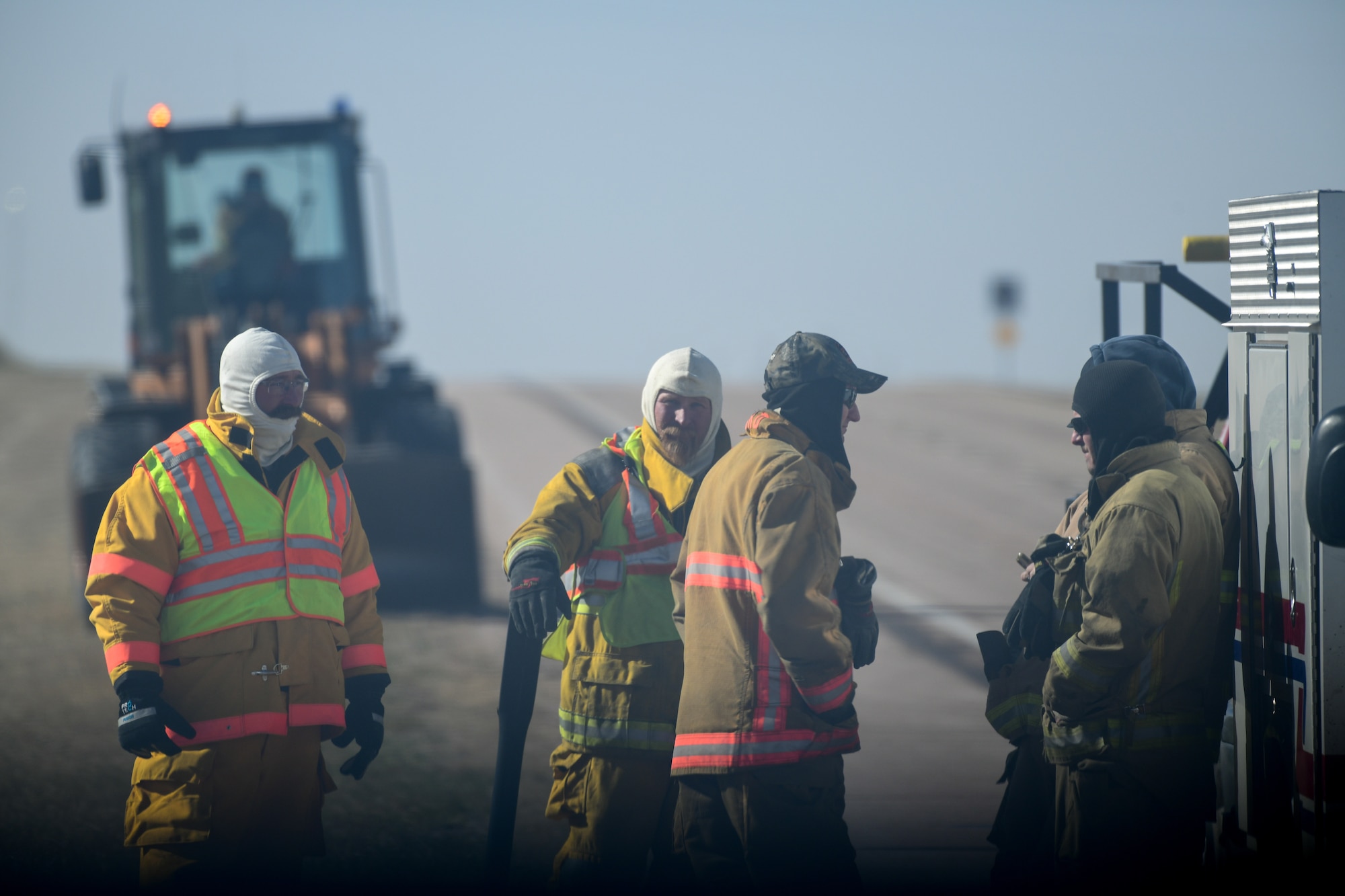 emergency responders at burned vehicle