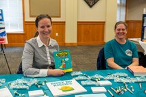 From left, Serena Sargent, 341st Missile Wing violence prevention integrator, and Michelle Johnston, 341st MW sexual assault prevention coordinator, provide resources for parents and Airmen April 12, 2022, at an education summit on Malmstrom Air Force Base, Mont. The summit provided an opportunity to educate parents on available resources and to highlight outside helping agencies on base and in the community. (U.S. Air Force photo by Airman 1st Class Elijah Van Zandt)