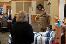 Lt. Col. Corrie Pecoraro, 341st Force Support Squadron commander, speaks with a substance abuse prevention counselor at an education summit April 13, 2022, at Malmstrom Air Force Base, Mont. Helping agencies from the installation and the Great Falls community attended the event to highlight their services for parents on base. (U.S. Air Force photo by Airman 1st Class Elijah Van Zandt)