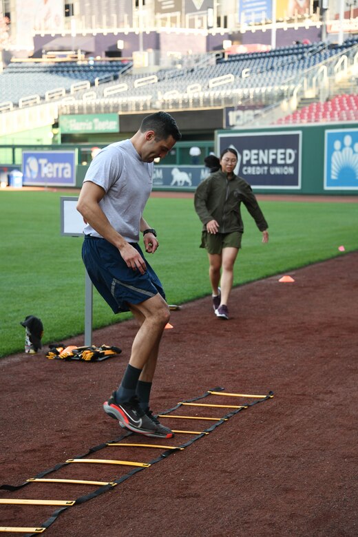 Military personnel stationed around the National Capital Region participate in a ladder workout at Nationals Park in Washington, D.C., April 14, 2022.