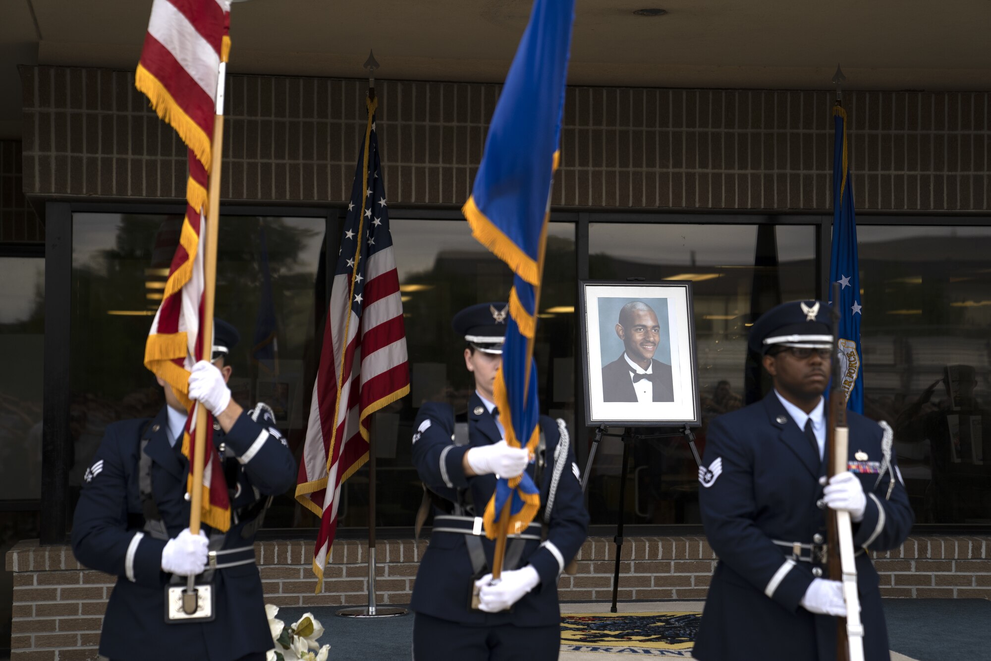 Members of the Keesler Honor Guard present the colors during the A1C Holt 5k Memorial Run outside the Levitow Training Support Facility at Keesler Air Force Base, Mississippi, April 15, 2022. The memorial run is an annual event to honor Airman 1st Class Antoine Holt, 603rd Air Control Squadron command and control battle management operations operator, who died while serving in Iraq. (U.S. Air Force photo by Airman 1st Class Trenten Walters)