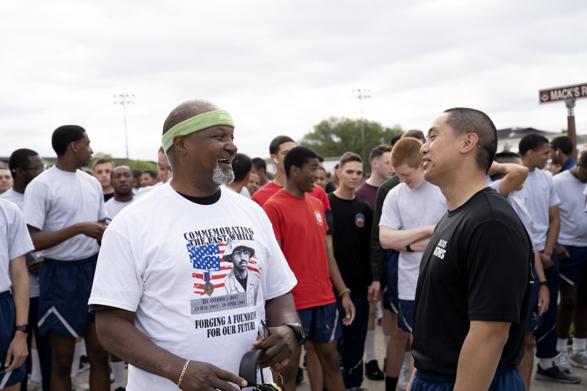 Michael Holt, U.S. Air Force Airman 1st Class Antoine Holt's father, speaks with a Chief Master Sgt. Mark Paraoan, 334th Training Squadron senior enlisted leader, at the Levitow Training Support Facility on Keesler Air Force Base, Mississippi, April 15, 2022. The A1C Holt Memorial Run is an annual event to honor Antoine, 603rd Air Control Squadron command and control battle management operations operator, who died while serving in Iraq. (U.S. Air Force photo by Airman 1st Class Trenten Walters)