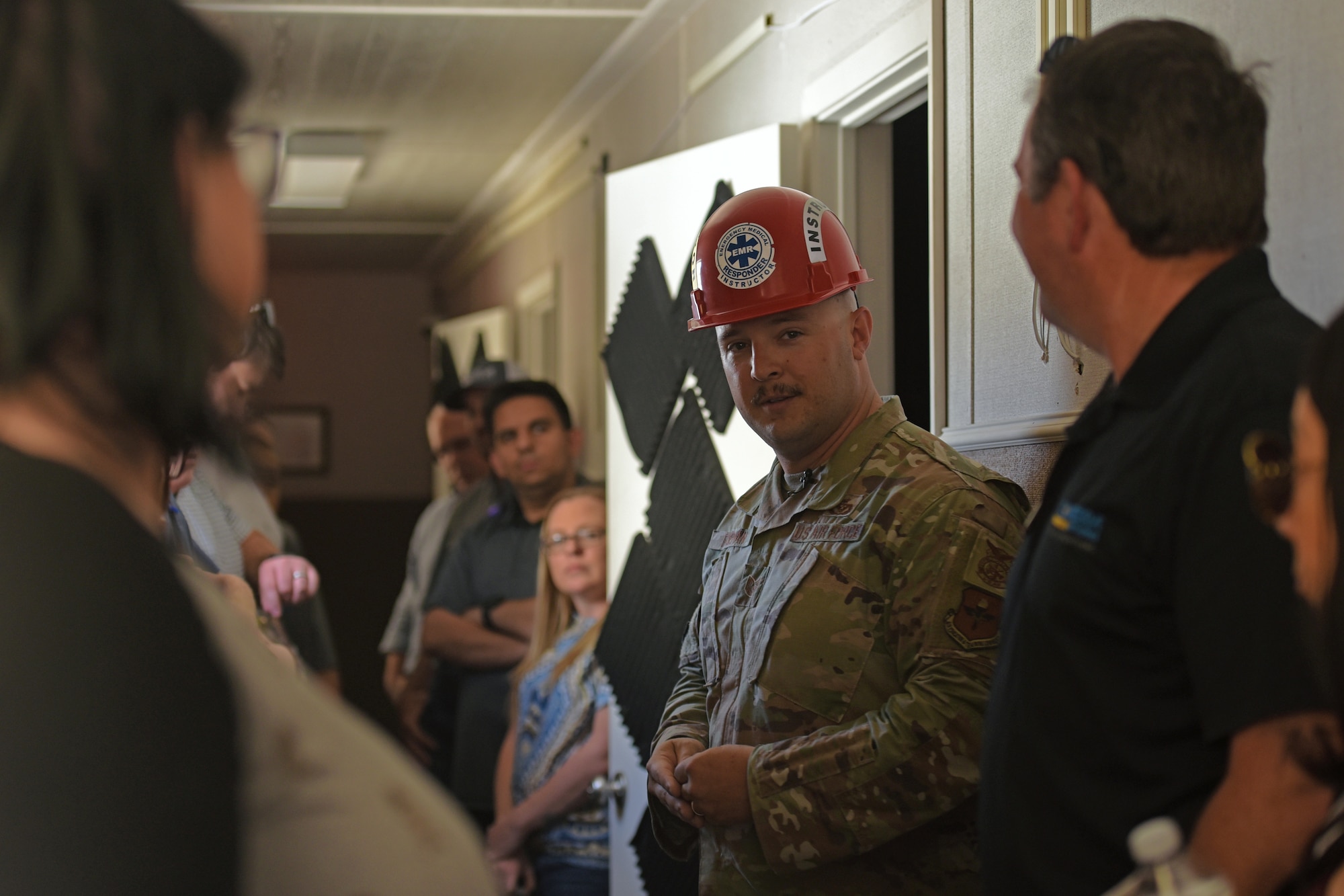 U.S. Air Force Tech. Sgt. Andrew Fruehan, 312th Training Squadron fire instructor and noncommissioned officer in charge, explains how community relationships has benefited the emergency medical responder course for the Leadership San Angelo base tour, Goodfellow Air Force Base, Texas, April 14, 2022. Two $60,000 medical manikins were donated to the Louis F. Garland Department of Defense Fire Academy from a local university; these manikins simulate real life EMR situations to test student knowledge. (U.S. Air Force photo by Senior Airman Abbey Rieves)