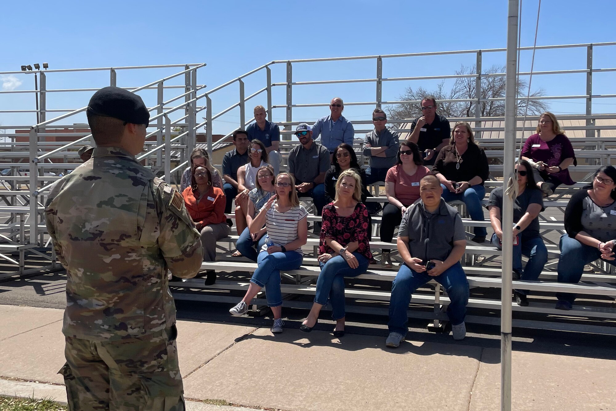 U.S. Air Force Tech. Sgt. Mario Rey, 17th Security Forces Squadron military kennel master, briefs community members during the Leadership San Angelo base tour, Goodfellow Air Force Base, Texas, April 14, 2022. Rey explained military working dogs’ capabilities, to include base security, and  explosive and drug detection. (U.S. Air Force photo by Senior Airman Abbey Rieves)