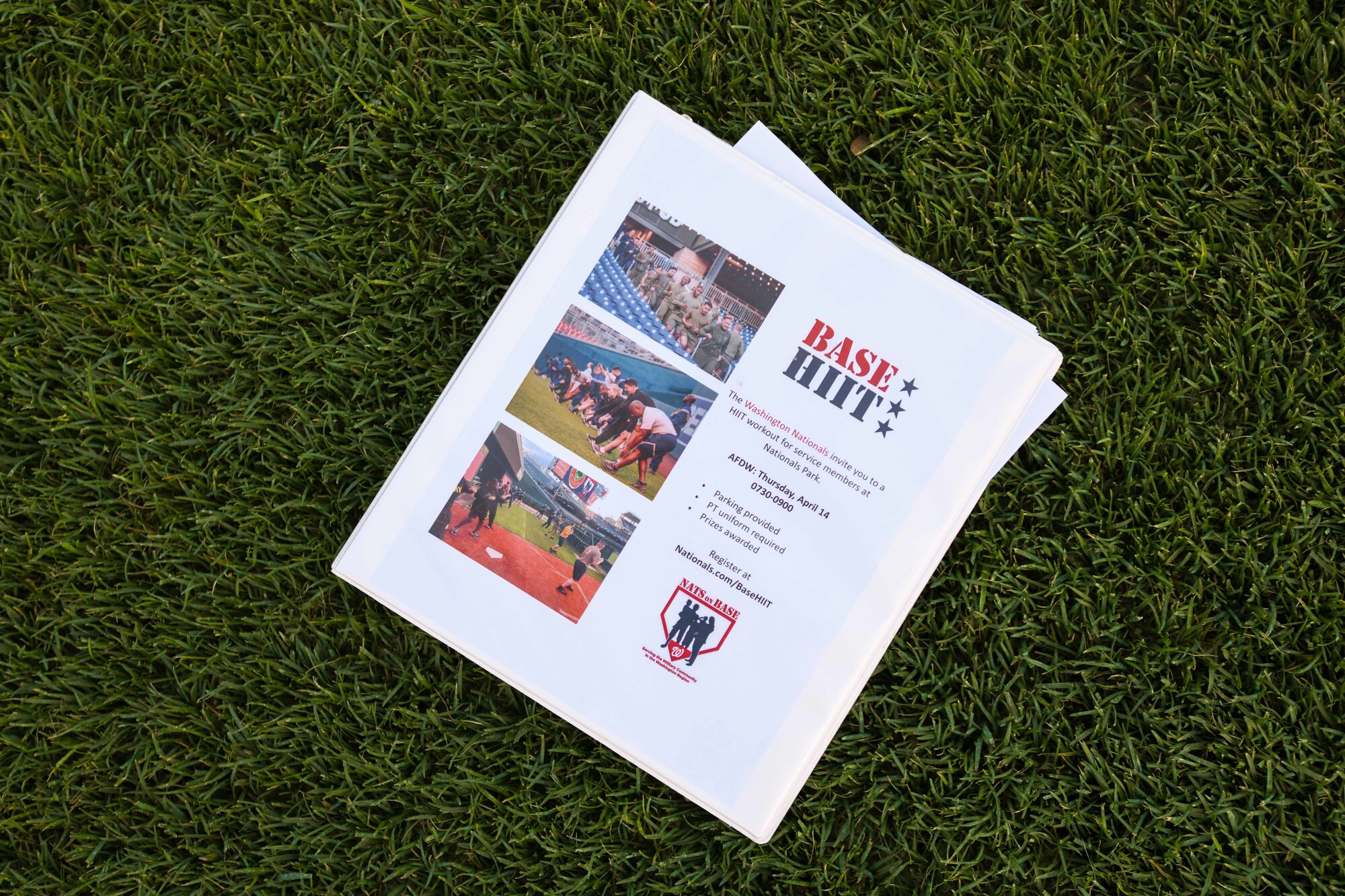 A paper event planner is left on the field during high-intensity interval training, known as the Base HIIT Workout, at Nationals Park, Washington D.C., April 14, 2022.