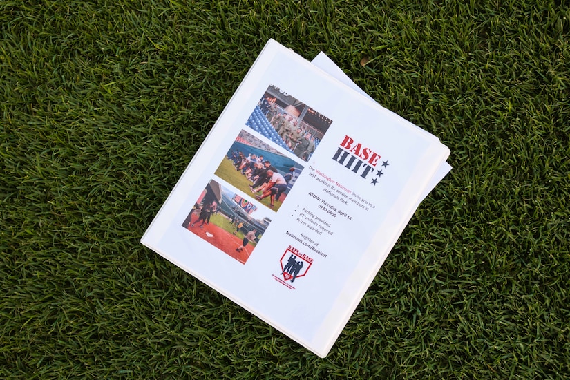A paper event planner is left on the field during high-intensity interval training, known as the Base HIIT Workout, at Nationals Park, Washington D.C., April 14, 2022.