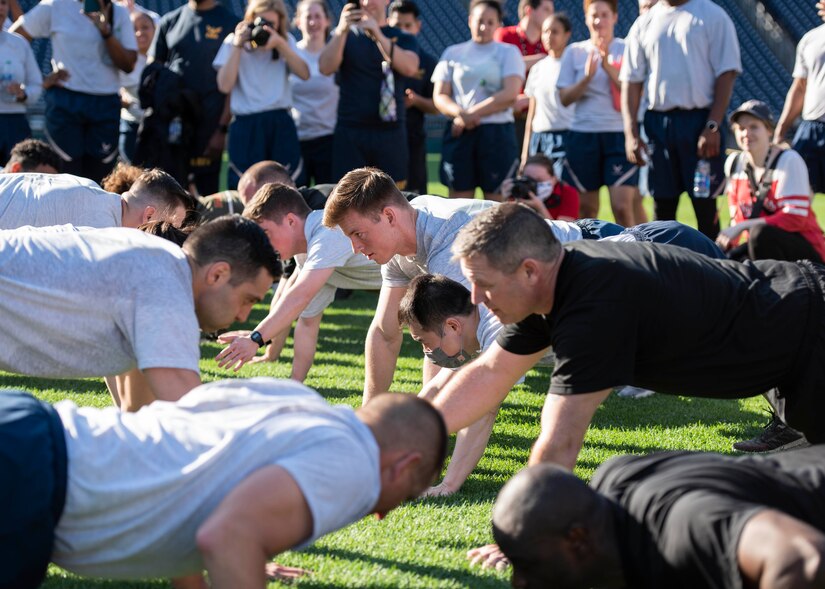 Military personnel stationed in the National Capital Region perform a push-up contest called the “Wheel of Death” at Nationals Park in Washington D.C., April 14, 2022.