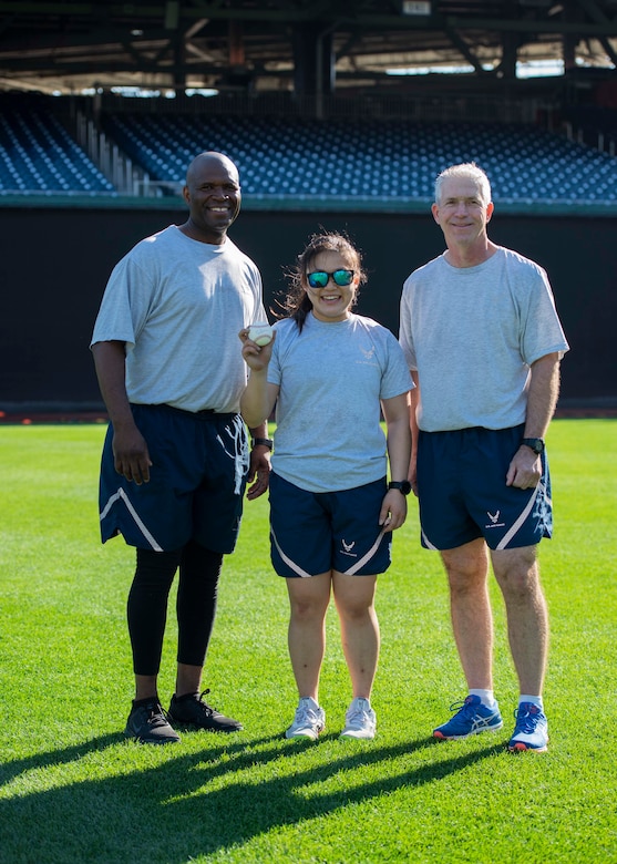 1st Lt. Esther Kim, poses for a photo with Maj. Gen. Joel Jackson, Air Force District of Washington and 320th Air Expeditionary Wing commander (right), and Chief Master Sgt. Leon Calloway, AFDW command chief (left), at Nationals Park in Washington D.C., April 14, 2022.