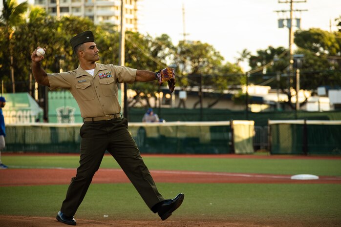 U.S. Marine Corps Col. Speros Koumparakis, commanding officer, Marine Corps Base Hawaii, throws the first pitch at the University of Hawai’i at Manoa versus University of California Riverside baseball game, Les Murakami Stadium, Honolulu, Hawaii, April 9, 2022. Koumparakis was invited to throw the first pitch during the pre-game festivities, which served as an opportunity to engage with the community and maintain the longstanding relationship between the University of Hawaii and MCBH. (U.S. Marine Corps photo by Lance Cpl. Chandler Stacy)