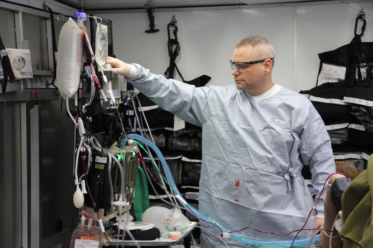 Maj. Adam Faltersack, 81st Surgical Operations Squadron anesthesia element chief, uses prototype A of the Tactical Anesthesia Workstation, or TAW, during a Ground Surgical Team training course at the U.S. Air Force School of Aerospace Medicine, Wright-Patterson Air Force Base, Ohio, April 8, 2022. Maj. Thomas Heering, an austere anesthesia cadre for the GST, 711th Human Performance Wing, submitted the TAW idea to the 2021 Spark Tank competition and the idea moved forward with a team of engineers in the rapid prototyping cell. (U.S. Air Force photo by Aleah Castrjon)