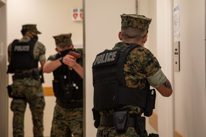 U.S. Marines with the Marine Corps Air Station Iwakuni Special Reaction Team, and the air station’s Provost Marshal’s Office conduct a barricaded suspect exercise at the Iwakuni Naval Family Branch Clinic at MCAS Iwakuni, Japan, April 8, 2022. SRT and PMO work side-by-side to conduct emergency drills in order to maintain their proficiencies and prepare for potential real-world contingencies on the installation.