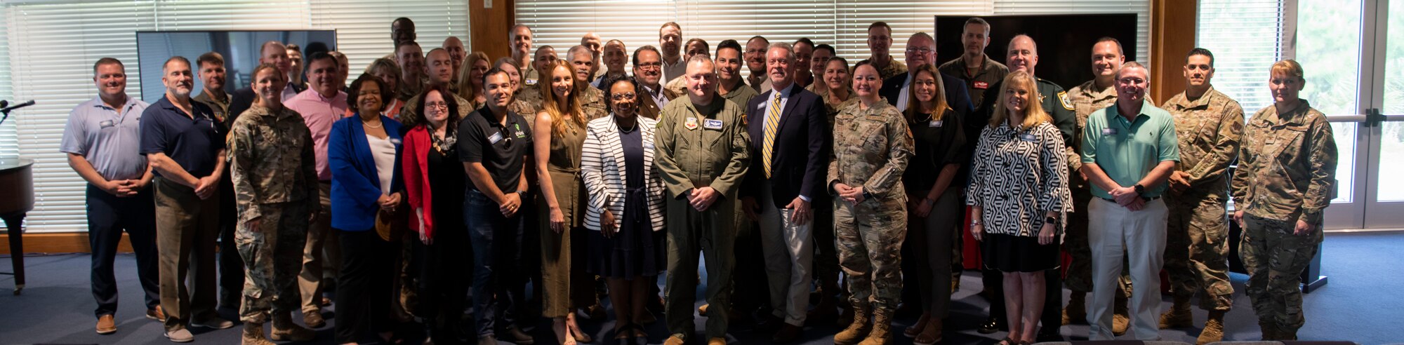 The newest class of Tyndall Air Force Base’s honorary commanders pose for a group photo with base leaders at Tyndall Air Force base, Florida, April 13, 2022.