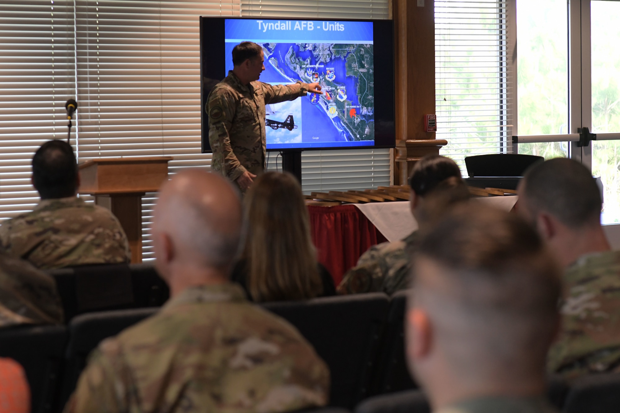U.S. Air Force Col. Greg Moseley, 325th Fighter Wing commander, explains the base’s various missions to the newest class of honorary commanders at Tyndall Air Force Base, Florida, April 13, 2022.