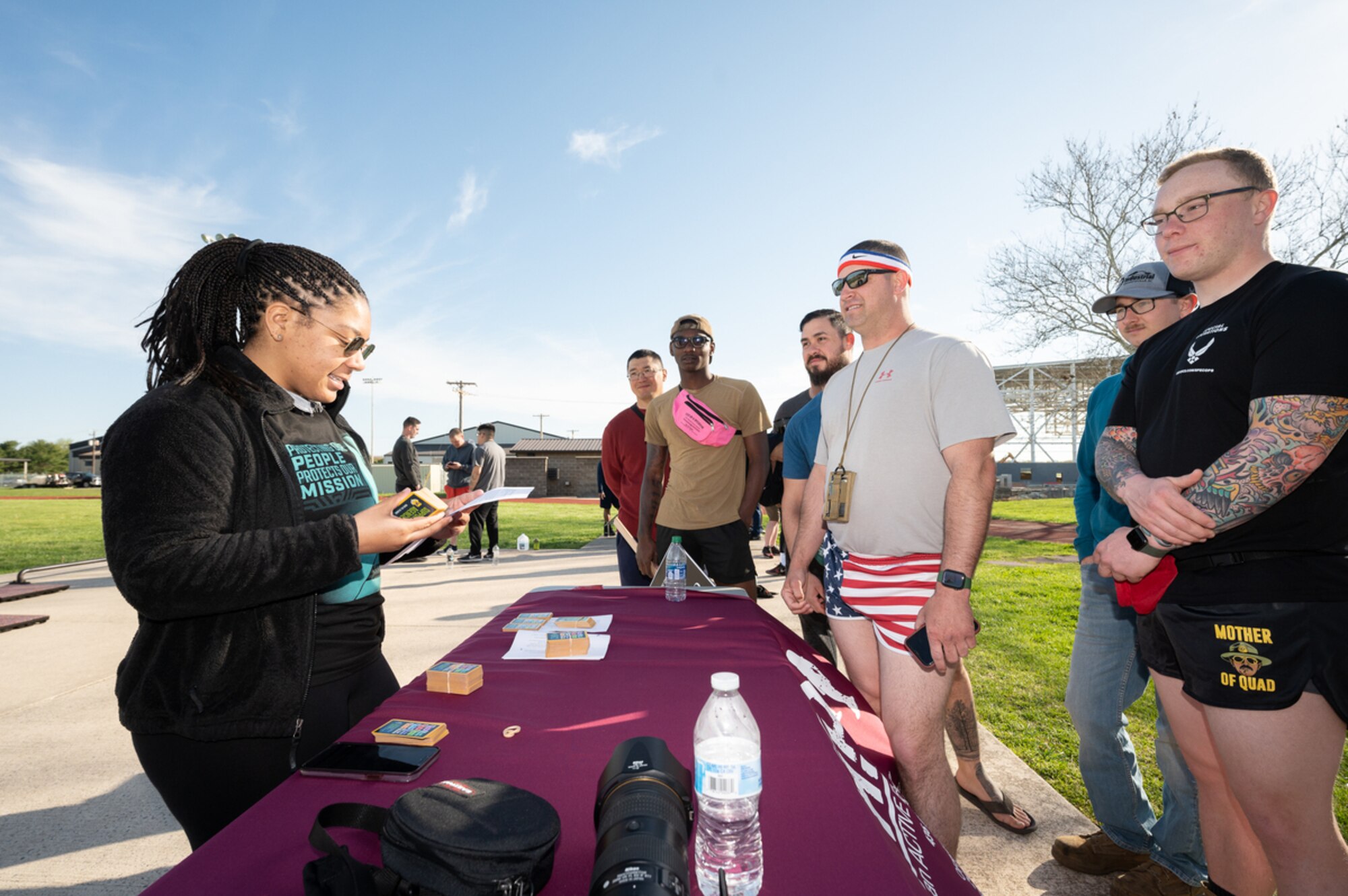 Participants in the 2022 Sexual Assault Awareness Prevention Month Flip Flop 5K Walk respond to scenario questions regarding sexual assault or harassment situations on Dover Air Force Base, Delaware, April 15, 2022. The course measured approximately 14,000 steps, which is the number of sexual assault cases reported annually across the Department of Defense. (U.S. Air Force photo by Mauricio Campino)