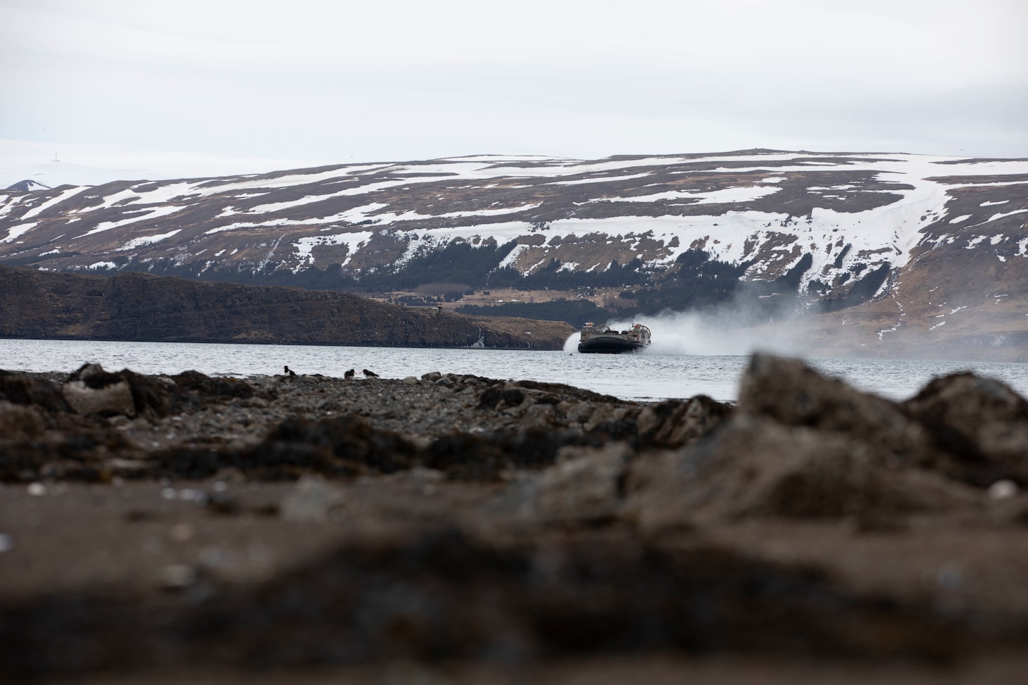 U.S. Navy Sailors assigned to the Kearsarge Amphibious Readiness Group and U.S. Marines with 22nd Marine Expeditionary Unit conduct ship-to-shore movements aboard a U.S. Navy landing craft, air cushion attached to Assault Craft Unit 4, in support of exercise Northern Viking 2022 in Miðsandur, Iceland, April 10, 2022.