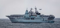 The German Sachsen-class air-defense frigate FGS Sachsen (F 219), front, and Wasp-class amphibious assault ship USS Kearsarge (LHD 3) transit in formation in the North Atlantic Ocean in support of exercise Northern Viking 22.