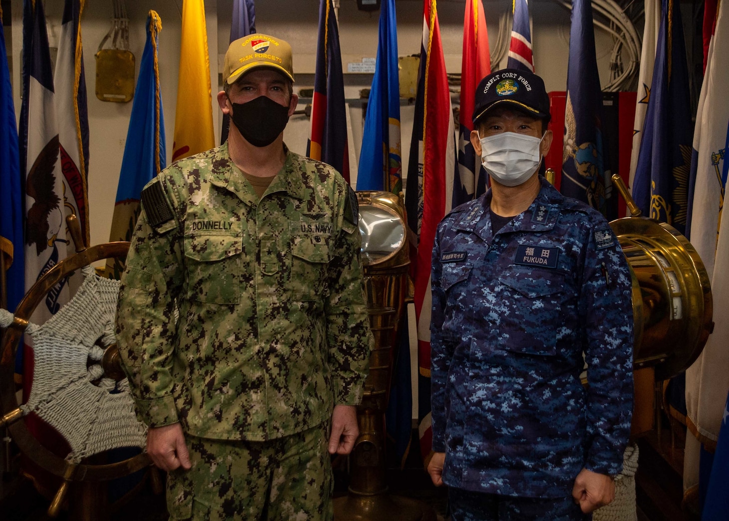 YOKOSUKA, Japan (April 15, 2022) Vice Adm. FUKUDA Tatsuya, commander, Fleet Escort Force, Japan Maritime Self-Defense Force and Rear Adm. Michael Donnelly, commander, Task Force (CTF) 70, pose for a photo following flag talks aboard the U.S. Navy’s only forward-deployed aircraft carrier, USS Ronald Reagan (CVN 76), flagship of Carrier Strike Group (CSG) 5. Flag talks allow commanders to plan for future operations, work through challenges or lessons learned, while building towards greater collaboration when their forces operate together in the maritime environment. CTF 70/CSG 5 is forward-deployed to the U.S. 7th Fleet area of operations in support of a free and open Indo-Pacific (U.S. Navy photo by Mass Communication Specialist 2nd Class Askia Collins)
