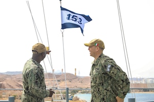 AQABA, Jordan (April 17, 2022) Capt. Robert Francis, commodore of newly established Combined Task Force (CTF) 153, left, and Capt. Daniel Prochazka, commanding officer of USS Mount Whitney (LCC 20), speak aboard the amphibious command ship in Aqaba, Jordan, April 17. CTF 153 is a Combined Maritimes Forces task force focused on maritime security and capacity building in the Red Sea, Bab al-Mandeb and Gulf of Aden. (U.S. Army photo by Cpl. DeAndre Dawkins)