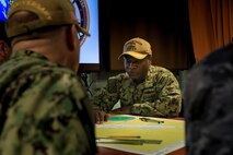 AQABA, Jordan (April 17, 2022) Capt. Robert Francis, commodore of newly established Combined Task Force (CTF) 153, meets with members of his staff aboard amphibious command ship USS Mount Whitney (LCC 20) in Aqaba, Jordan, April 17. CTF 153 is a Combined Maritimes Forces task force focused on maritime security and capacity building in the Red Sea, Bab al-Mandeb and Gulf of Aden. (U.S. Army photo by Cpl. DeAndre Dawkins)