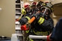 Sailors and Military Sealift Command civilian mariners assigned to the submarine tender USS Emory S. Land (AS 39) conduct a fire drill in coordination with Joint Region Marianas and Guam fire departments, Feb 1.