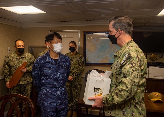 YOKOSUKA, Japan (April 15, 2022) Vice Adm. FUKUDA Tatsuya, commander, Fleet Escort Force, Japan Maritime Self-Defense Force and Rear Adm. Michael Donnelly, commander, Task Force (CTF) 70, exchange gifts prior to conducting flag talks aboard the U.S. Navy’s only forward-deployed aircraft carrier, USS Ronald Reagan (CVN 76), flagship of Carrier Strike Group (CSG) 5. Flag talks allow commanders to plan for future operations, work through challenges or lessons learned, while building towards greater collaboration when their forces operate together in the maritime environment. CTF 70/CSG 5 is forward-deployed to the U.S. 7th Fleet area of operations in support of a free and open Indo-Pacific (U.S. Navy photo by Mass Communication Specialist 2nd Class Askia Collins)