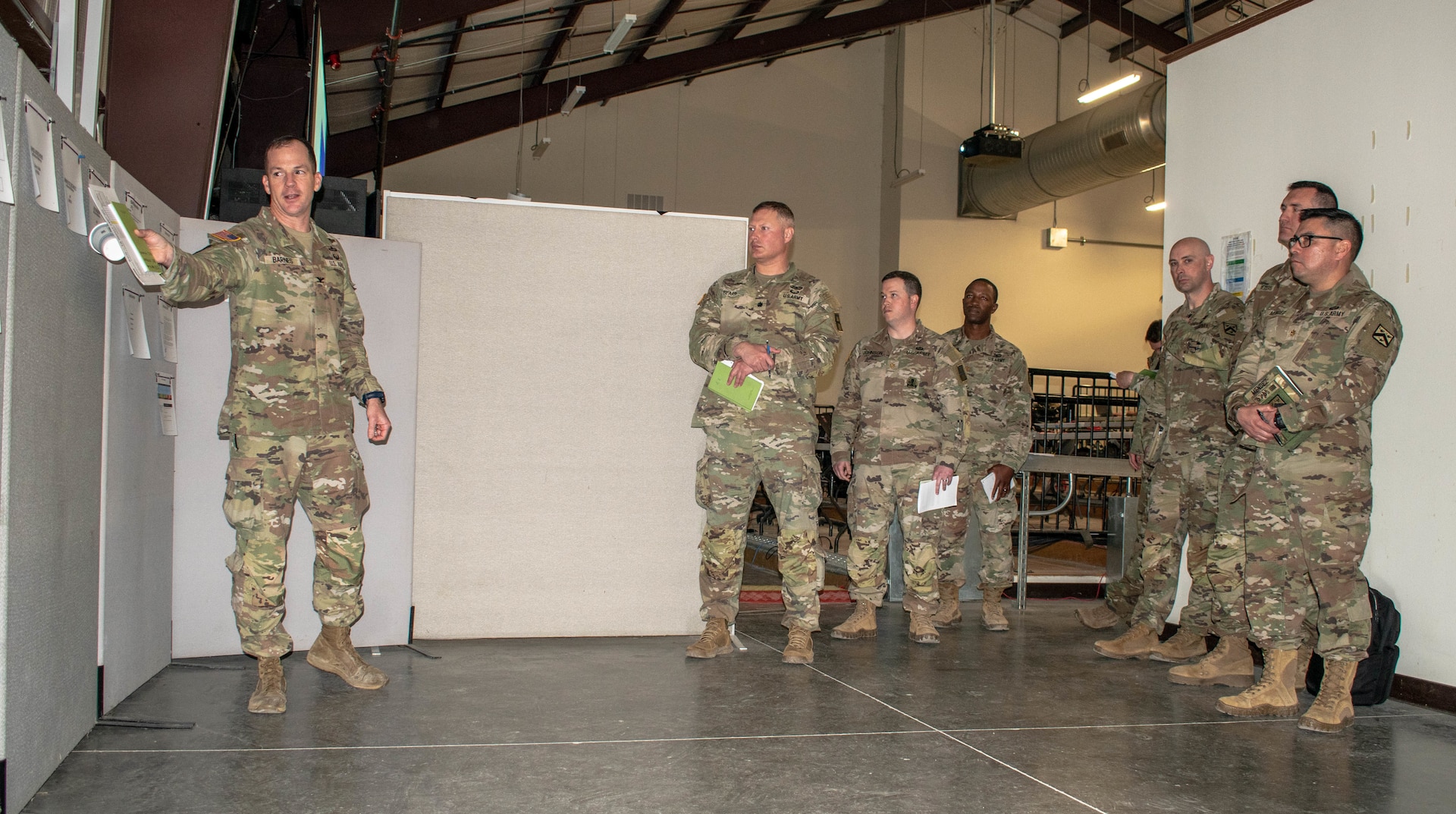 Col. Hank Barnes, left, commander of 189th Infantry Brigade, Division West – First Army, the 189th Infantry Brigade, provides training product guidance to staff engaged in the 40th Infantry Division’s Command Post Exercise II at North Fort Hood, Texas, April 4, 2022.